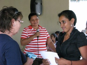 Brenda congratulating graduates 