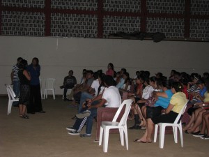 Tanya speaking to students while Brenda was talking to the women and Tom was talking to the men 